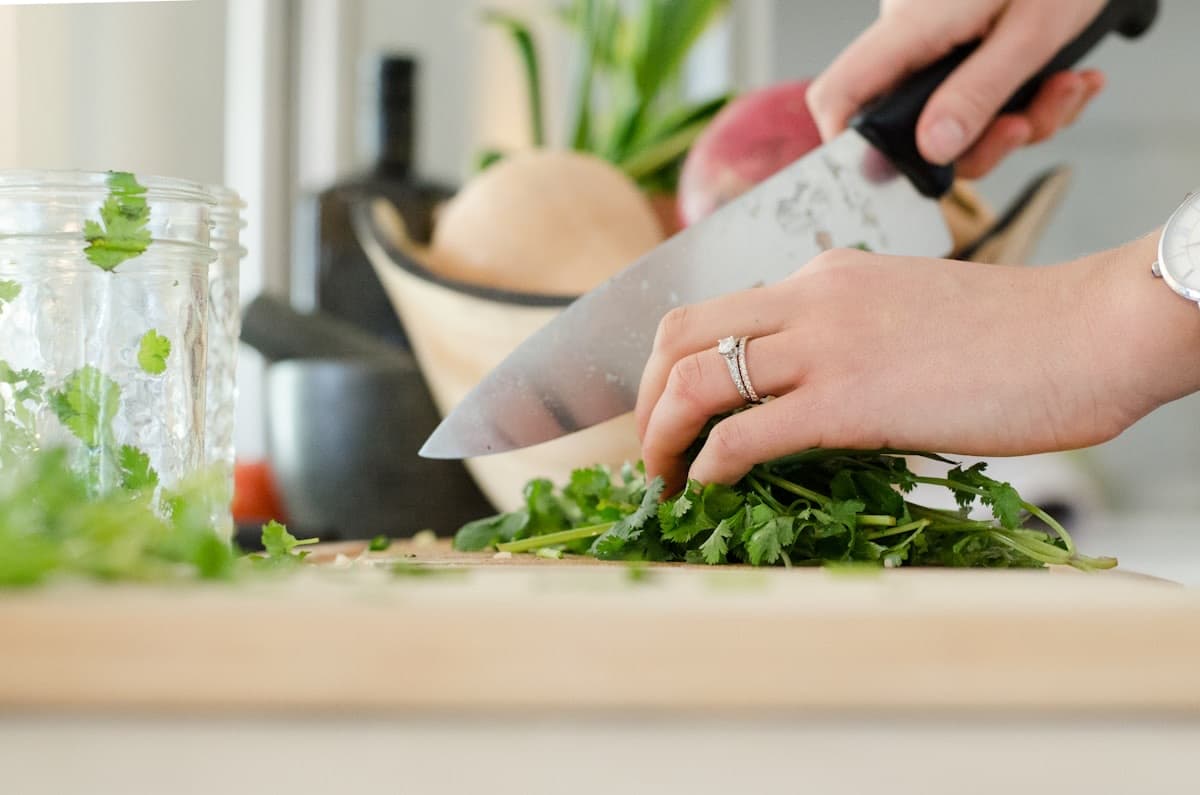 Chopping fresh herbs on a wood board